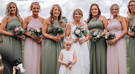Smiling bridesmaids and flower girl at The Tanning Room, Hall Green, England, GB, showcasing elegant dresses.