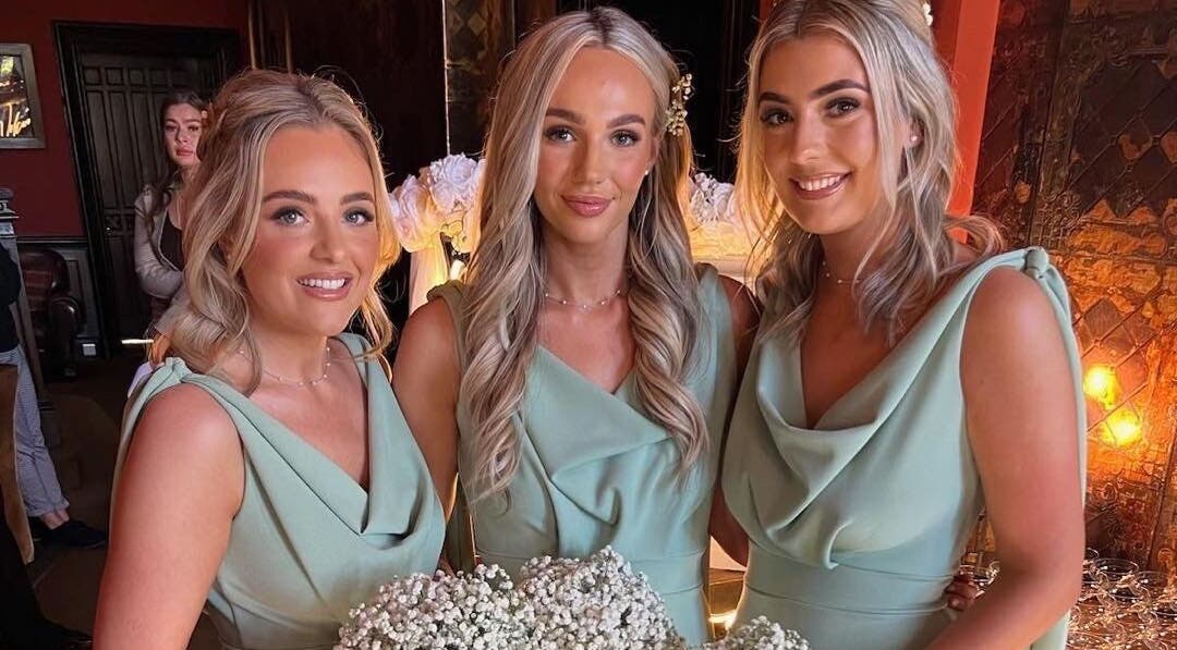 Three women in evening gowns at The Tanning Room, Hall Green, England, GB, showcasing event elegance.
