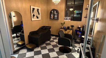 Cozy interior of Tarot Hair Studio in Menasha, Wisconsin, US, featuring stylish chairs and modern decor.