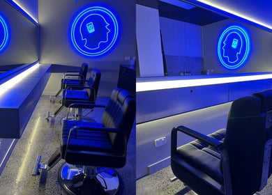 Modern salon chairs in blue-lit interior at Hearts & Minds Tuggerah (World Gym), Tuggerah, New South Wales, AU.