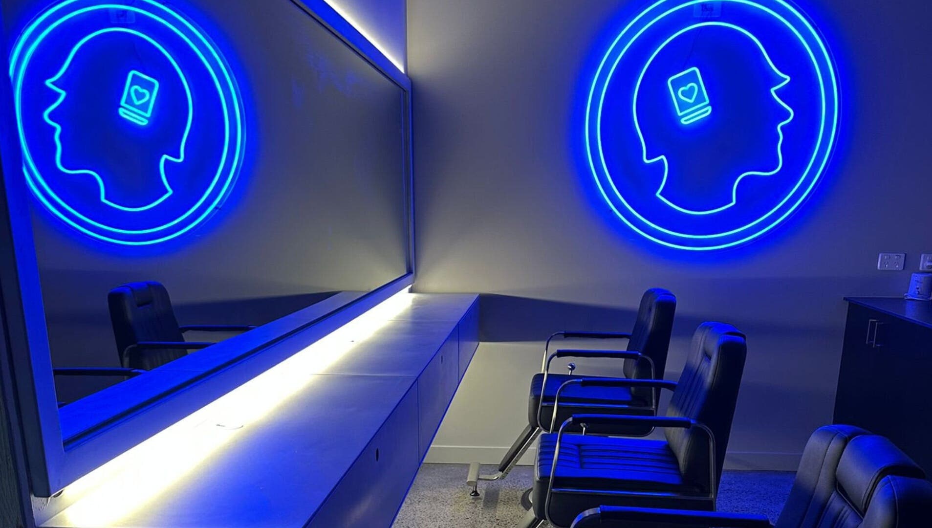 Modern seating area with neon art at Hearts & Minds Tuggerah (World Gym), Tuggerah, New South Wales, AU.
