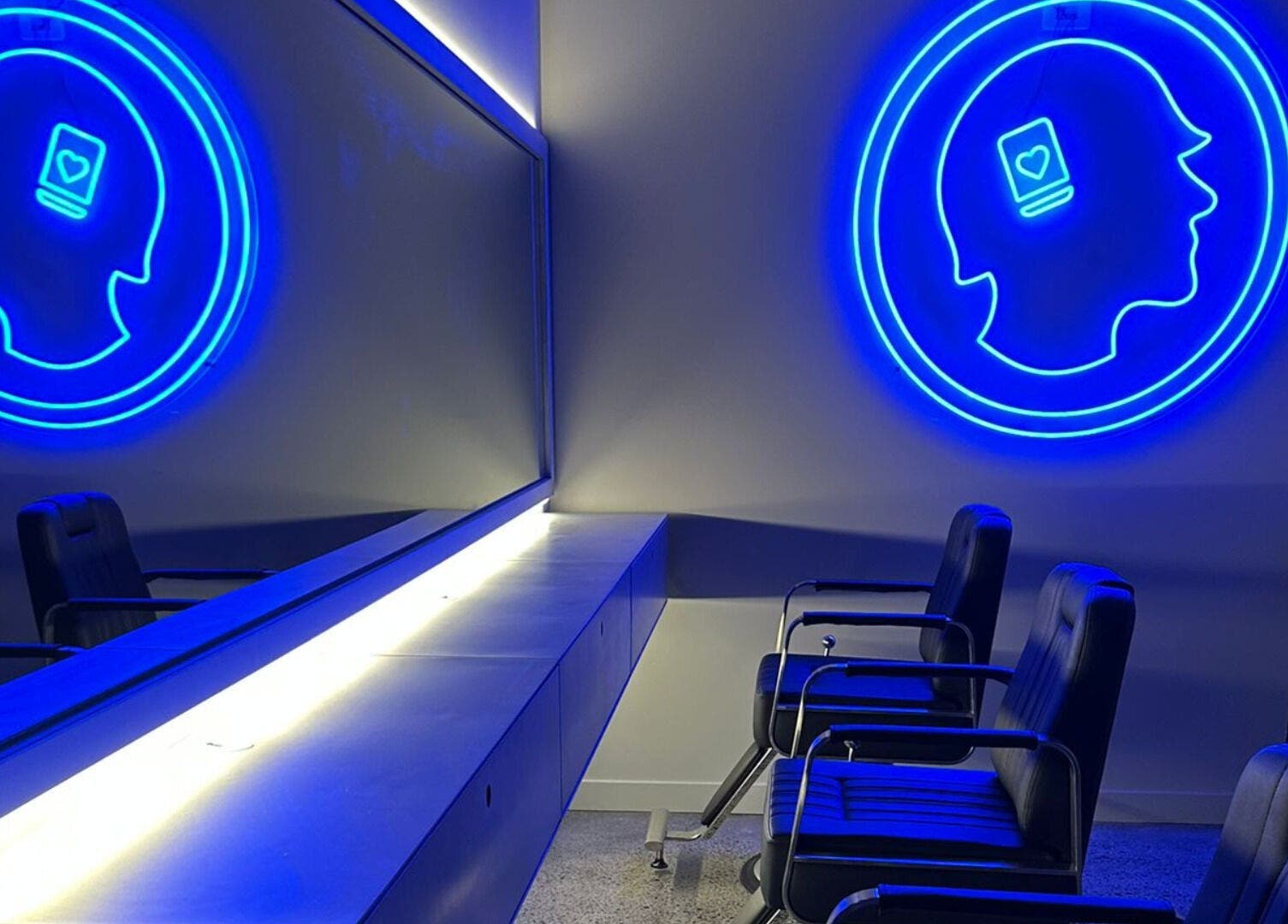 Modern seating area with neon art at Hearts & Minds Tuggerah (World Gym), Tuggerah, New South Wales, AU.