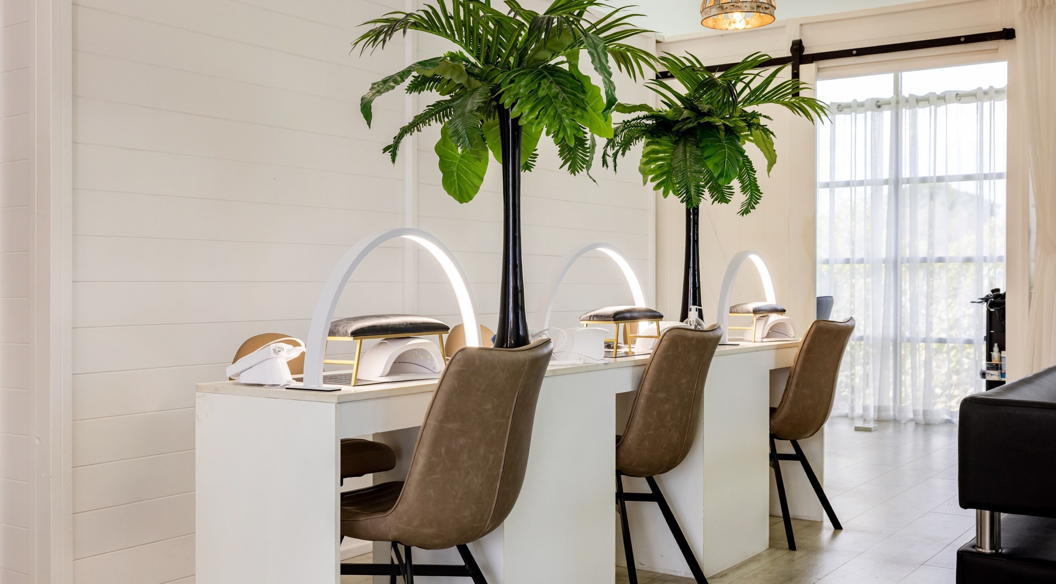 Modern nail station at RendezVou Beauty Emporium, Hope Island, Queensland, AU with elegant design elements.