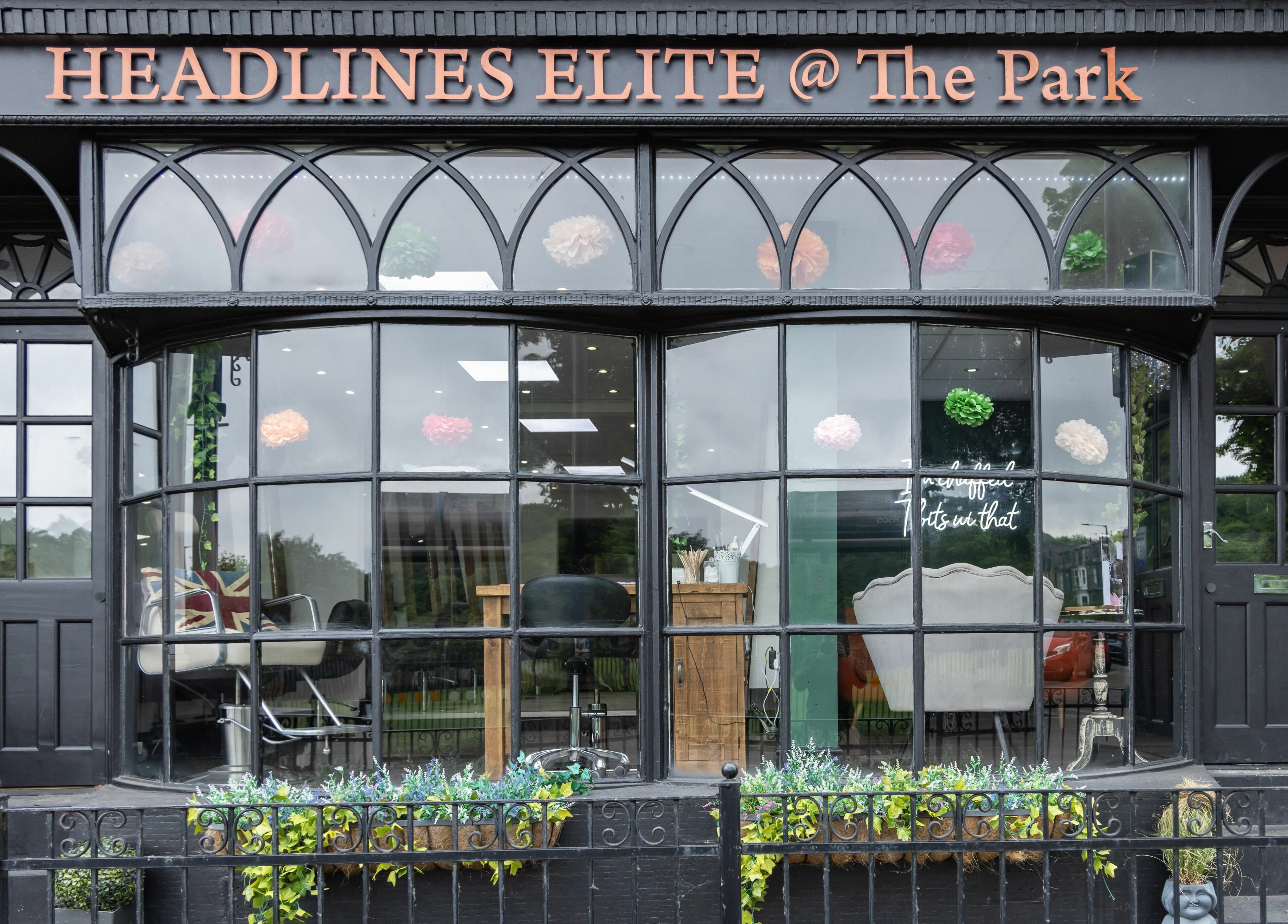 Front view of Headlines Elite in Sheffield, England, GB, showcasing stylish decor and large windows.