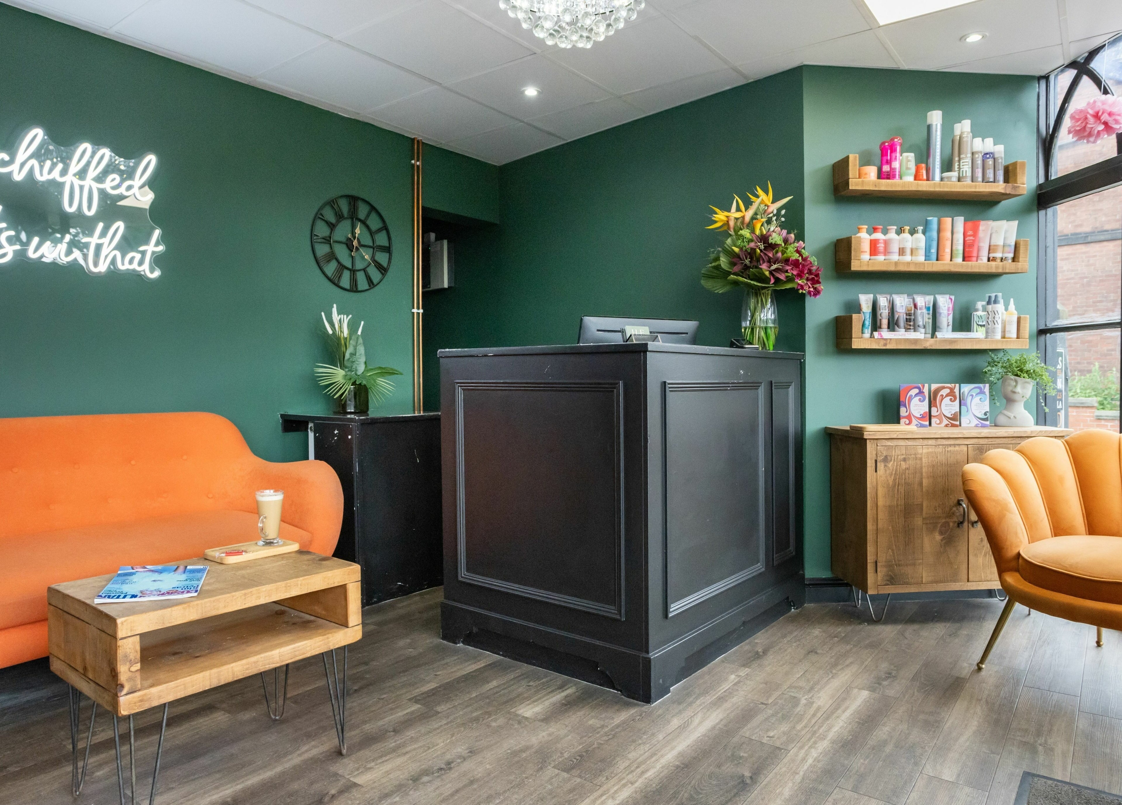 Modern reception at Headlines Elite in Sheffield, England, GB with vibrant seating and stylish decor.