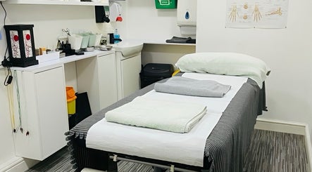 Cozy treatment room at Yakushi Healing Centre in Sandiacre, England, GB, offering wellness therapies.