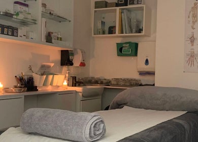 Cozy therapy room at Yakushi Healing Centre, Sandiacre, England, GB with candles and relaxing ambiance.