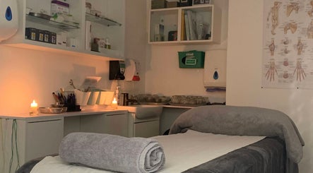 Cozy therapy room at Yakushi Healing Centre, Sandiacre, England, GB with candles and relaxing ambiance.