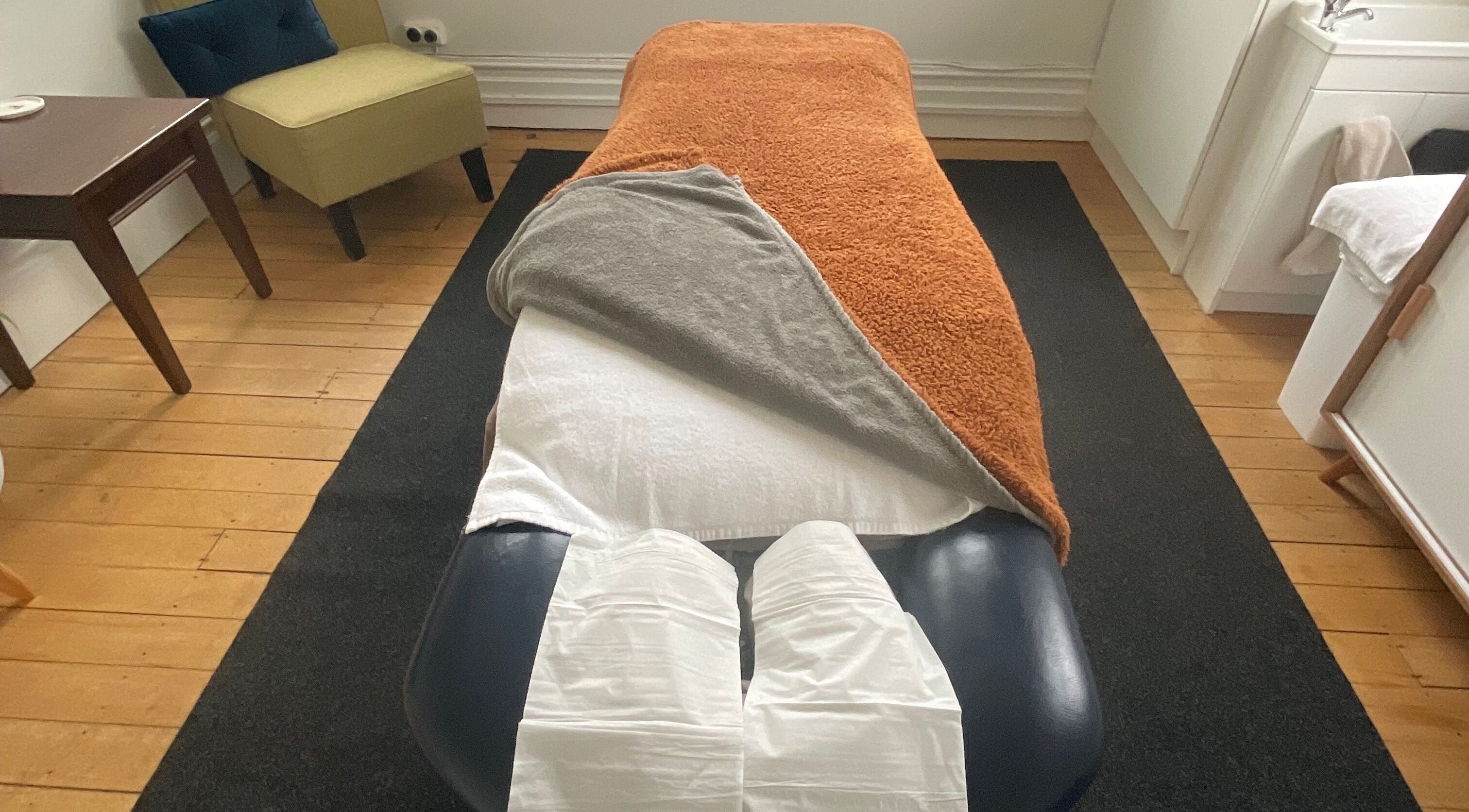 Tranquil massage room at Divine Alchemy Dunedin, featuring a cozy bed setup in Dunedin, Otago, NZ.
