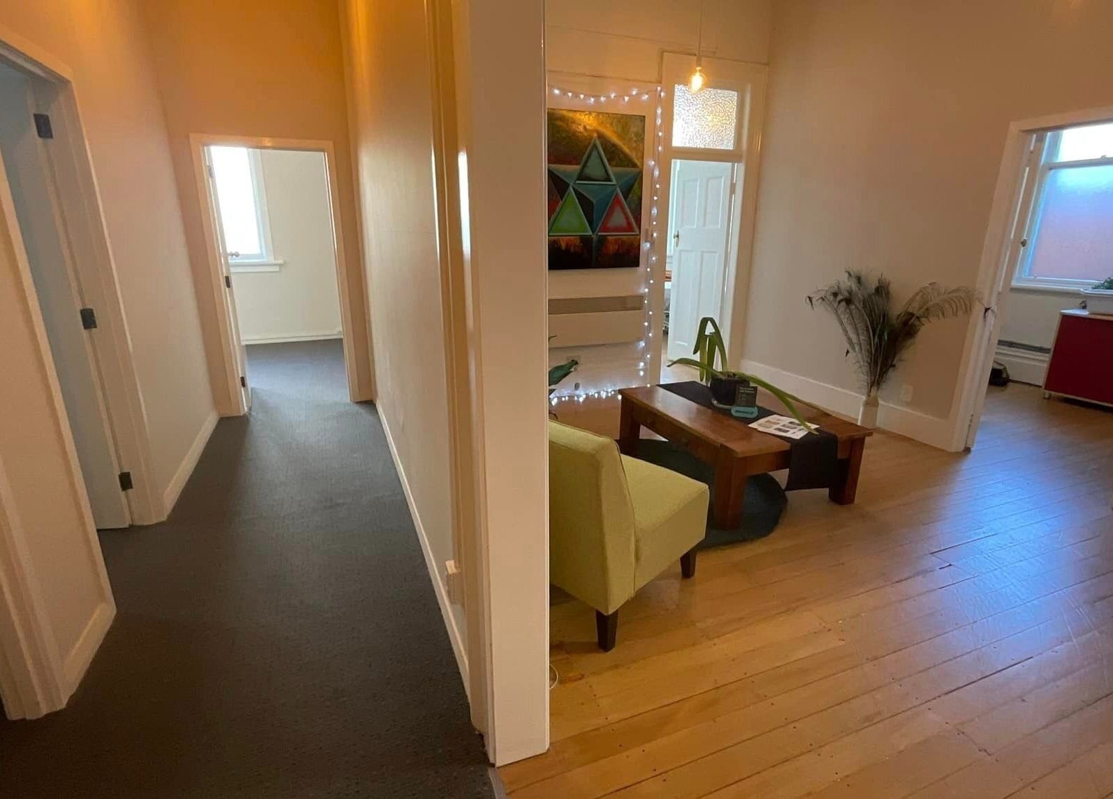 Inviting interior of Divine Alchemy Dunedin in Dunedin, Otago, NZ, featuring warm lighting and cozy seating.