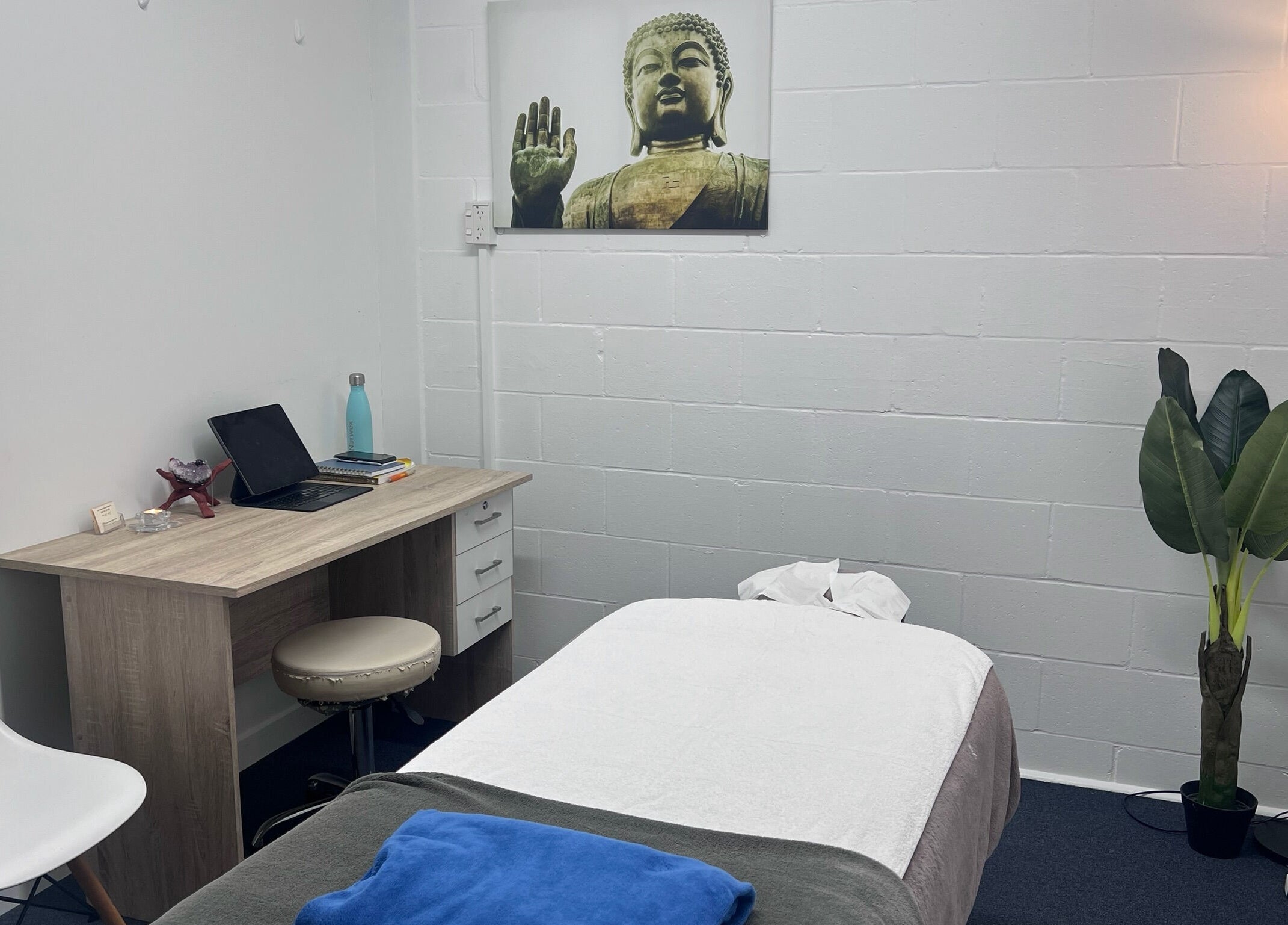 Serene massage room at Divine Alchemy Winton, Winton, Southland, NZ featuring calming decor and warm lighting.