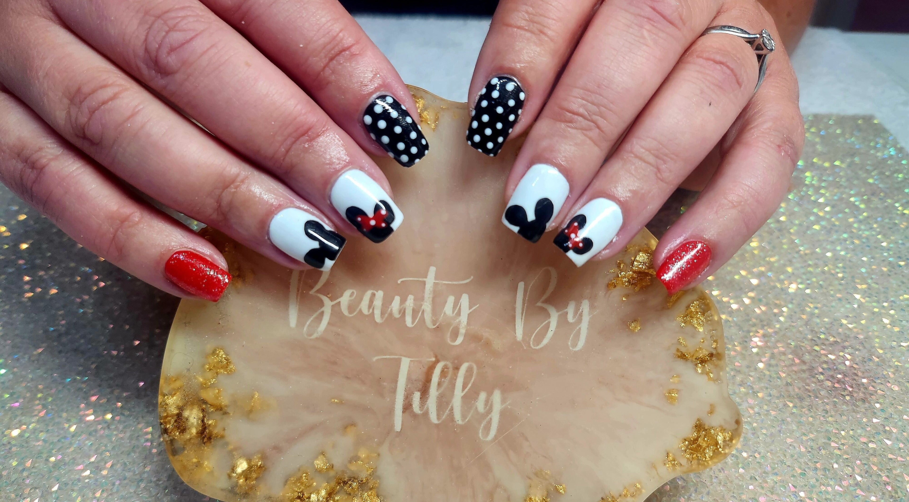 Stylish nail art featuring polka dots at Beauty By Tilly, Bradford, England, GB.