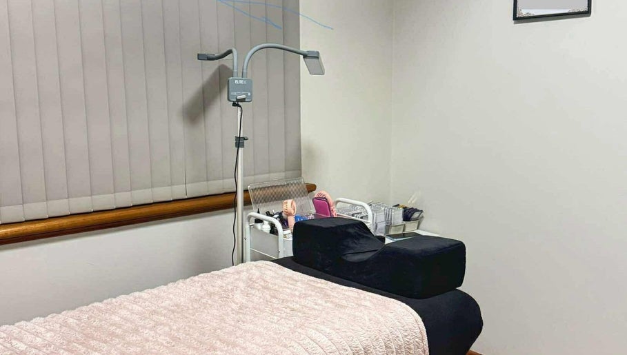 Hertime Lashes treatment room in Maylands, WA with a cozy bed and beauty tools, ideal for relaxation.