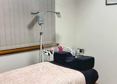 Hertime Lashes treatment room in Maylands, WA with a cozy bed and beauty tools, ideal for relaxation.