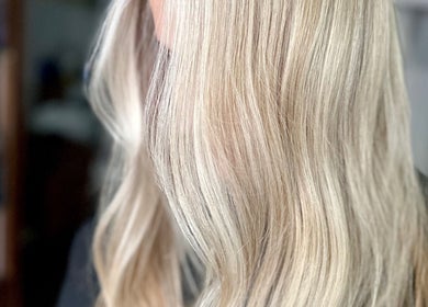 Blonde hair styled in waves at Studio 58 at Deluxe, Maidstone, England, GB.