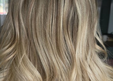 Blonde hair styled in waves at Studio 58 at Deluxe in Maidstone, England, GB.
