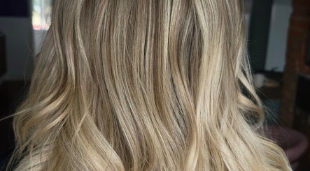Blonde hair styled in waves at Studio 58 at Deluxe in Maidstone, England, GB.