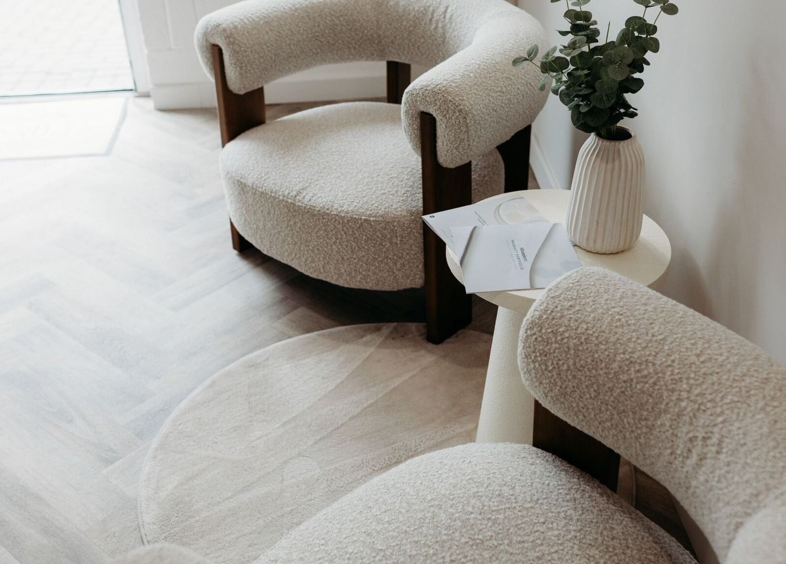 Stylish seating area at Rachel Abbie (RA) Aesthetics HQ, Lelant, England, GB, featuring plush chairs and a vase.