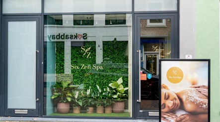 Front entrance of Six Zen Spa in Breda, Noord-Brabant, NL with lush greenery and welcoming signage.