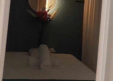 Serene room at Six Zen Spa in Breda, Noord-Brabant, NL, featuring a massage table with inviting ambiance.