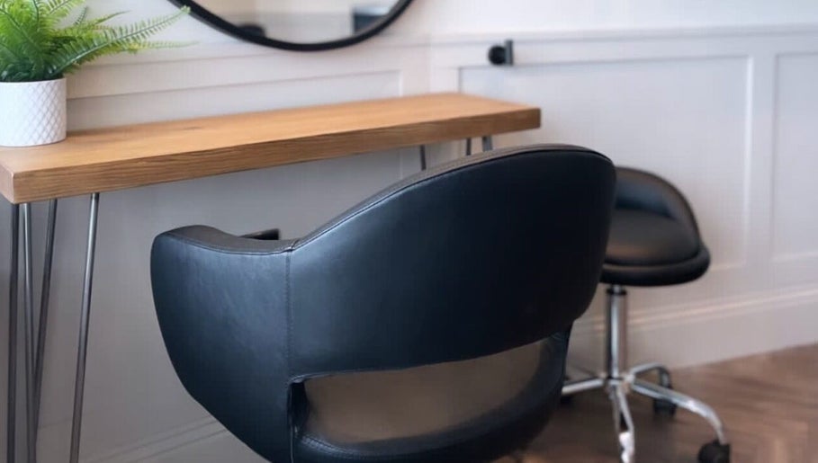 Chic salon chair and desk at Amy at Thirteen in Swalwell, England, GB for a modern beauty experience.