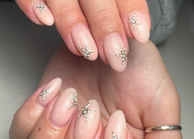 Close-up of embellished nude nails at Nails by Lauren M, Morpeth, England, GB.