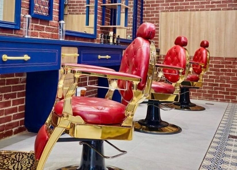 Stylish barber chairs at Doc Barnet - Aljada Solo, Sharjah, Sharjah, AE showcasing classic elegance.
