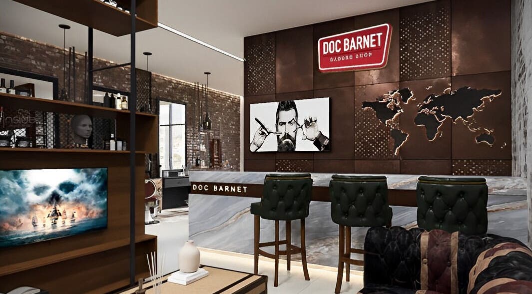 Interior of Doc Barnet - Nasma Resident in Sharjah, AE showcasing stylish salon design with leather chairs.