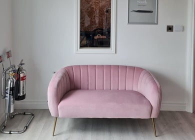 Cozy pink couch at Silk Touch Lashes Glenrothes, Scotland, GB. Elegant lounge area enhancing client experience.