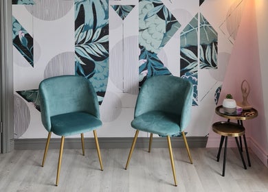 Elegant seating area at Silk Touch Lashes Glenrothes, Glenrothes, Scotland, GB, featuring stylish teal chairs.