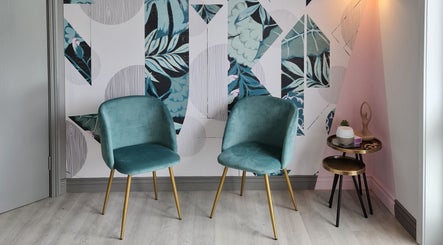 Elegant seating area at Silk Touch Lashes Glenrothes, Glenrothes, Scotland, GB, featuring stylish teal chairs.