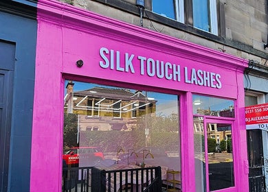 Silk Touch Lashes Edinburgh storefront with bright pink facade in Edinburgh, Scotland, GB.