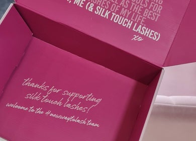 Open pink box with 'Silk Touch Lashes Edinburgh' message, located in Edinburgh, Scotland, GB.