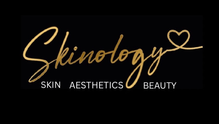 Skinology logo with gold script on black background, Westerham, England, GB.