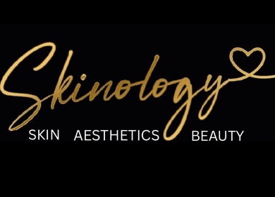 Skinology logo with gold script on black background, Westerham, England, GB.