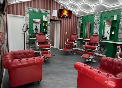 Modern red barber chairs and stylish interior at The Head Office Barber Shop, Nassau, BS.