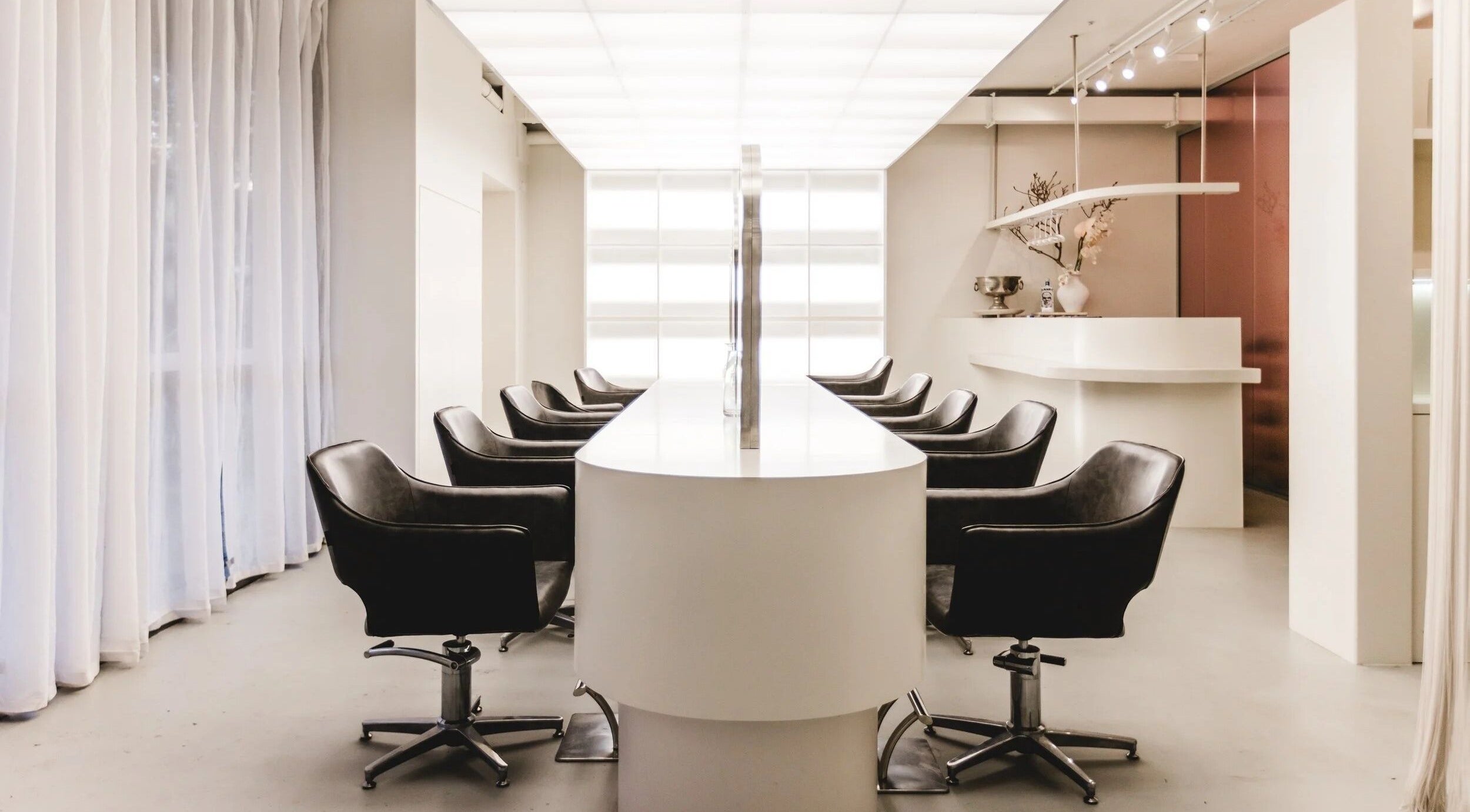 Modern salon interior with sleek chairs at Made Salon & Aesthetics, Wollongong, New South Wales, AU.