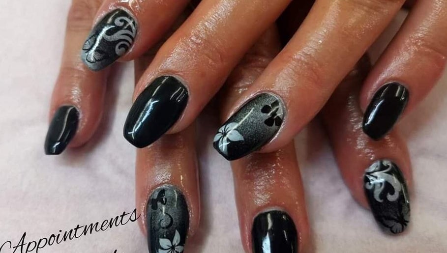 Intricate black and silver nail art at Nails by Christina, Bridgwater, England, GB.