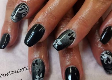 Intricate black and silver nail art at Nails by Christina, Bridgwater, England, GB.