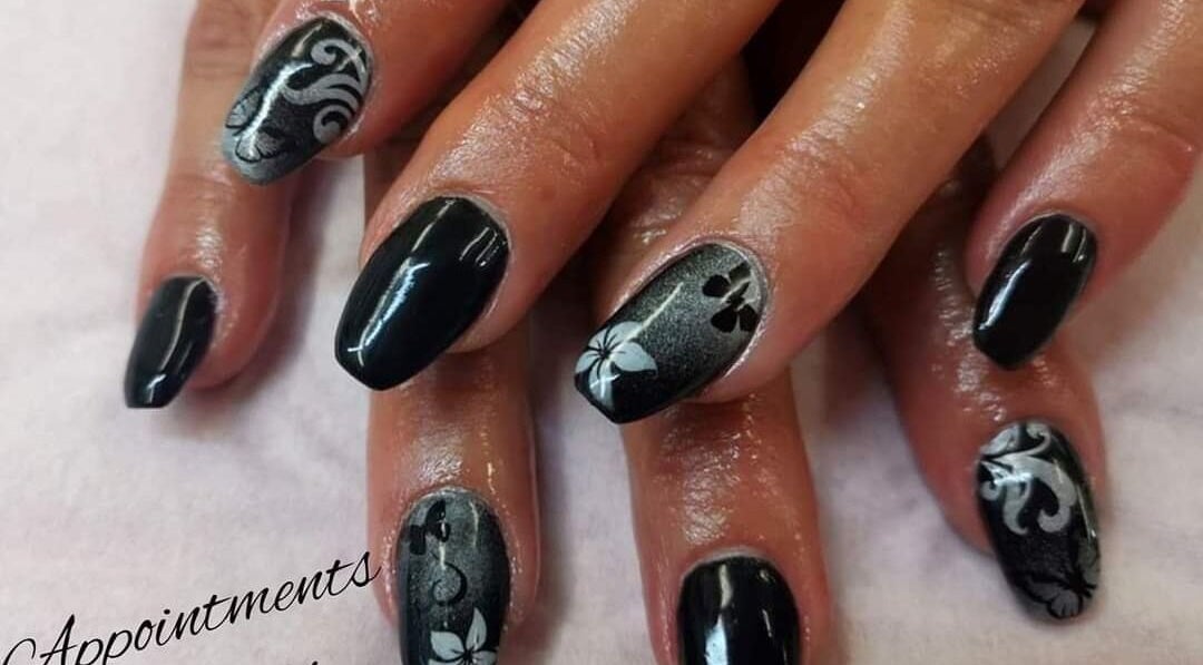 Intricate black and silver nail art at Nails by Christina, Bridgwater, England, GB.