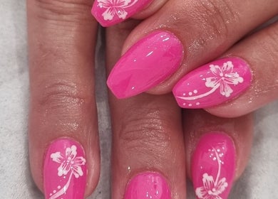 Pink nails with floral designs at Nails by Christina, Bridgwater, England, GB.