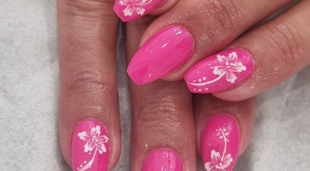 Pink nails with floral designs at Nails by Christina, Bridgwater, England, GB.