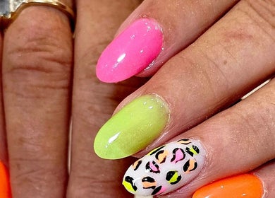 Bright neon nails with leopard print at Nails by Christina, Bridgwater, England, GB.