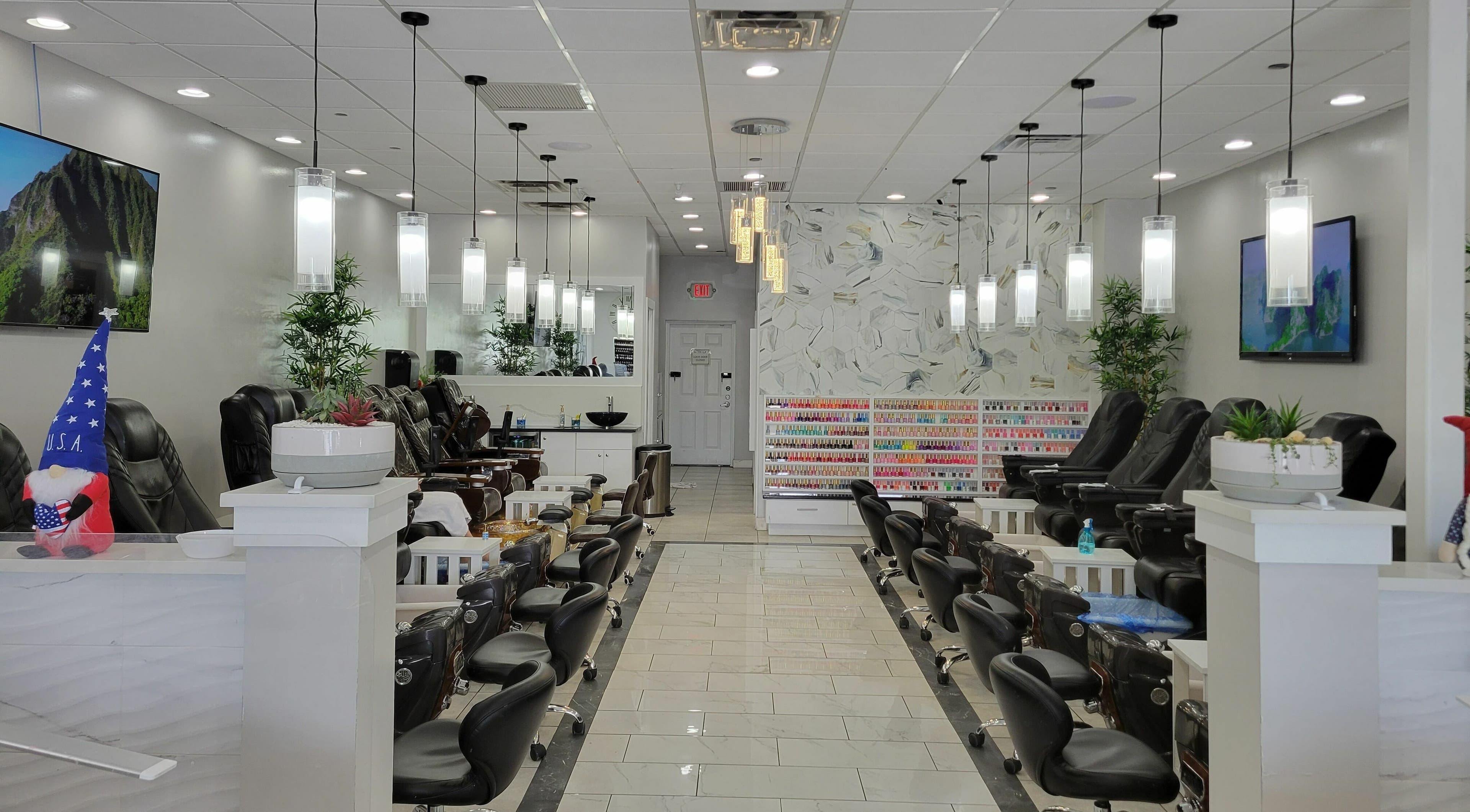 Interior of NiNi Nails Salon in Tampa, Florida, US featuring stylish manicure stations and elegant decor.