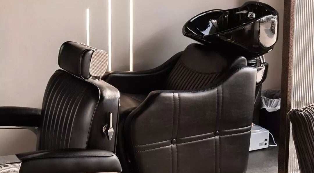 Luxurious salon chair at The BND - Barber Next Door, Abu Dhabi, AE showcases comfort and style.