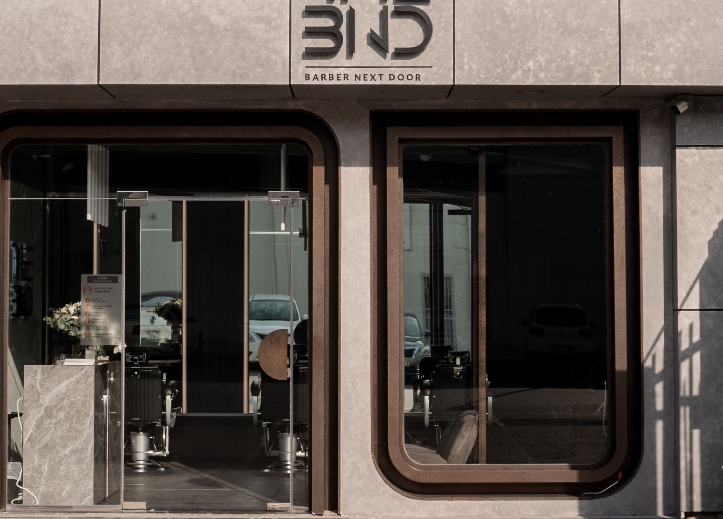 Front entrance of The BND - Barber Next Door in Abu Dhabi, AE showcasing modern design.