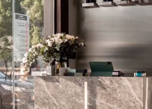 Reception area at The BND - Barber Next Door, Abu Dhabi, AE, featuring elegant decor and natural light.