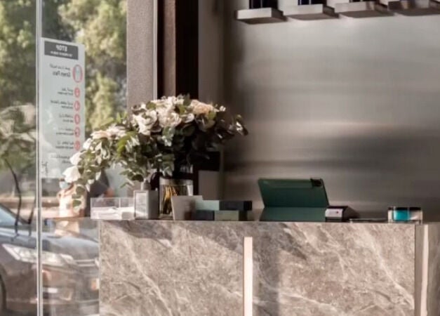 Reception area at The BND - Barber Next Door, Abu Dhabi, AE, featuring elegant decor and natural light.