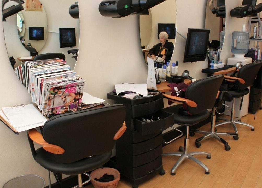 Chic interior of Bruno Hair and Makeup, Lindfield, NSW, AU with salon chairs and mirrors.