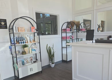 Elegant reception area at The Spa Bar in Manchester, New Hampshire, US showcasing beauty products and modern decor.